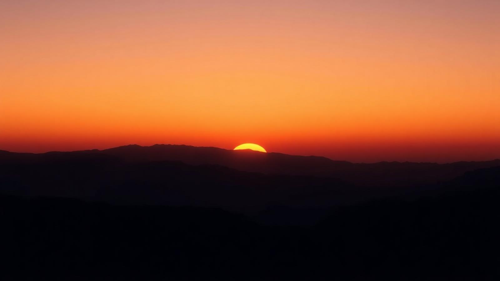 Sunrise over mountains representing transformation in ninety days